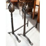 Pair of wrought iron fire-dogs with spiral and foliate finials, 58 cm high