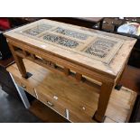 A Chinese elm rectangular coffee table, the top with pierced panels carved with figures and