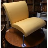 A contemporary yellow fabric (zip cover) tubular alloy framed easy chair