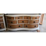 Willis & Gambier 'Helena' range nine drawer chest, cream painted and lacquered wood, on turned feet,