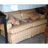 A Multiyork two seater scroll arm sofa, with old gold diamond pattern loose covers c/w two scatter