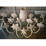 Five cream-painted metal twin-sconce wall lights with star motif