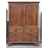 A 19th century mahogany wardrobe/compactum, the top with panelled doors enclosing hanging rail on