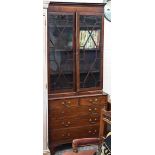 A 19th century mahogany bookcase with astragal glazed doors raised on a chest base with two short