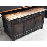 Antique carved and panelled oak coffer with candle box fitted interior, 126 cm wide x 58 cm deep x