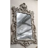 A large wall mirror in light grey rococ style composite frame, 150 x 90 cm wide