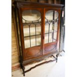 A part glazed red walnut display cabinet on stand, early 20th century