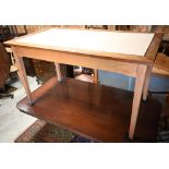 A modern oak  dining table with rectangular aperture to the top - previously fitted with a glass
