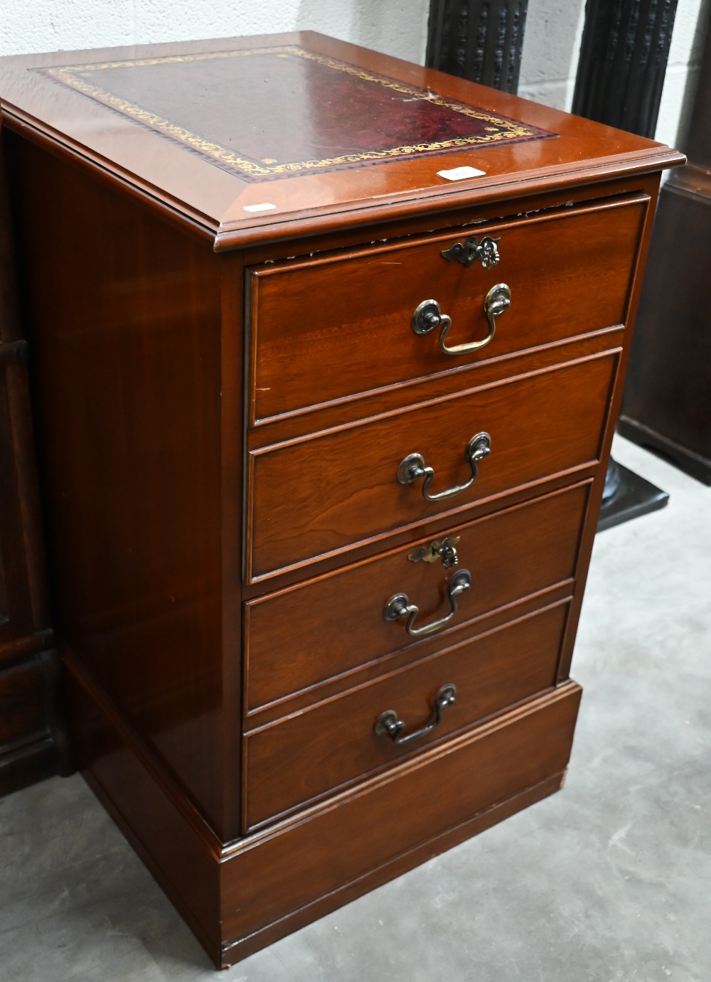 A mahogany two drawer filing chest with gilt tooled burgundy leather top, 50 cm wide x 60 cm deep