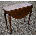 A Georgian mahogany oval drop-leaf supper table on gateleg base