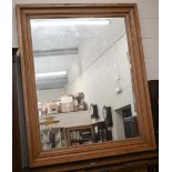 A large rectangular mirror in rustic moulded waxed pine frame, 155 x 128 cm
