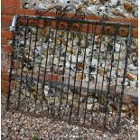 An old weathered wrought iron garden gate