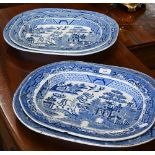 Four early 19th century Ironstone Willow pattern meat dishes, 45/40 cm wide (one smaller dish