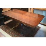 A Victorian style crossbanded mahogany veneered dining table, the rectangular top over a turned