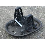 An antique cast iron boot-scraper