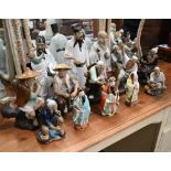 Fourteen various Chinese porcelain and glazed earthenware figures