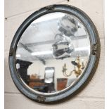 A 1950s bevelled circular wall mirror, 45 cm diam