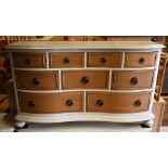 Willis & Gambier 'Helena' range nine drawer chest, cream painted and lacquered wood, on turned feet,