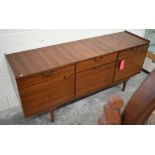 A mid century Meredew rosewood sideboard circa 1960, the drawers and panelled cupboards fitted