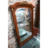 An antique Biedermeier gilt metal mounted burr yew over-mantel mirror, the arched plate with