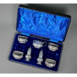 A late Victorian cased silver condiment set, E.S. Barnsley & Co, Birmingham 1896, 8.7oz  Heavily