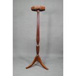A Sheraton inlaid satinwood and mahogany torchere, the octagonal top with wavy edged gallery