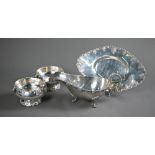 A white metal sauce boat on stand, to/w a matching pair of small bowls, stamped 'Silver' (4 pieces -