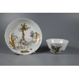 An 18th century Chinese European subject tea bowl and saucer, painted in grisaille and iron red with
