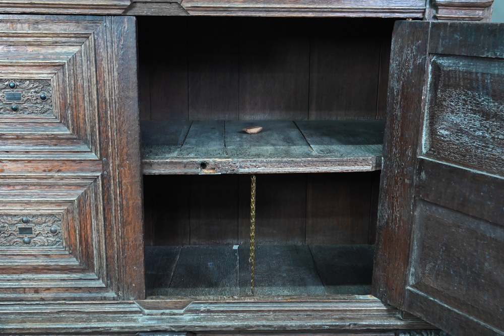 A 17th century jointed oak cupboard, with two moulded panelled doors over a full width drawer, - Image 8 of 10