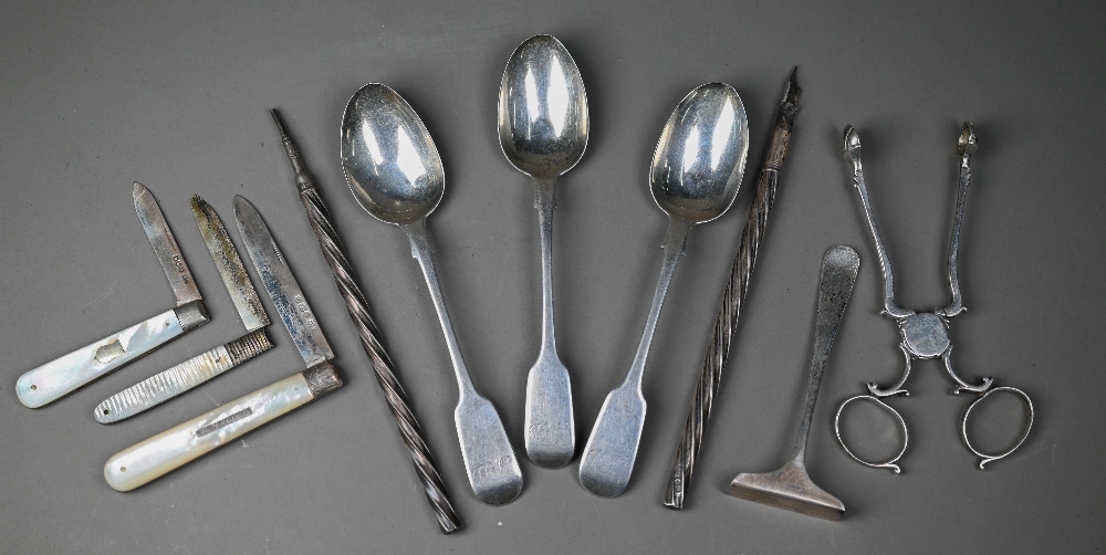 A pair of Georgian silver sugar-nips with scroll handles and shell bowls (assay mark only), to/w