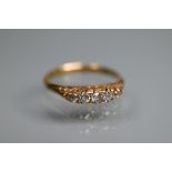 A five-stone graduated diamond ring set 18ct yellow gold, size N, approx 2.5g all in