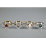 Four various 9ct rings one set oval aquamarine, size N, round zircon size M, oval pale opal size