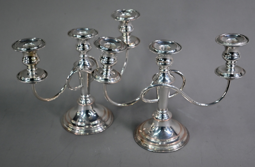 Pair of plated on copper three-sconce candelabra on baluster stems, 21cm high