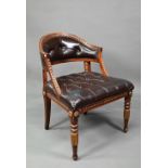 Theodore Alexander, a part gilt decorated neo-classical style buttoned brown leather chair