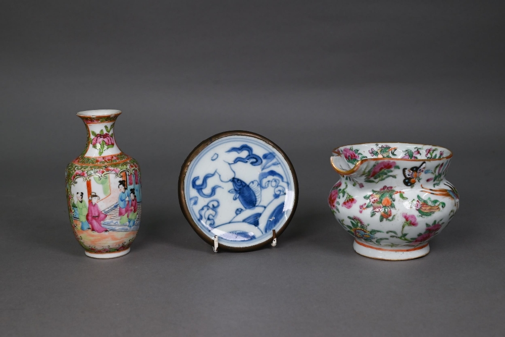 A 19th century Chinese Canton famille rose jug painted in polychrome enamels with birds, butterflies
