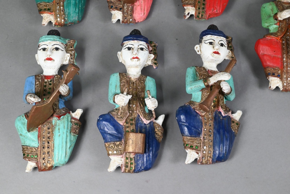 A set of seven vintage polychrome Burmese temple musician wall plaques, carved hardwood with - Image 3 of 9