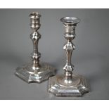 A pair of loaded silver baluster candlesticks in the Queen Anne manner, Hawksworth, Eyre & Co,