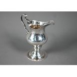 Hester Bateman: a silver baluster cream jug with impressed beaded rim, scroll handle and stemmed