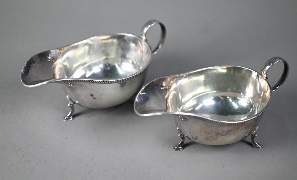 Pair of silver sauce boats with scroll handles and hoof feet, Martin, Hall & Co, Sheffield 1925, 7.