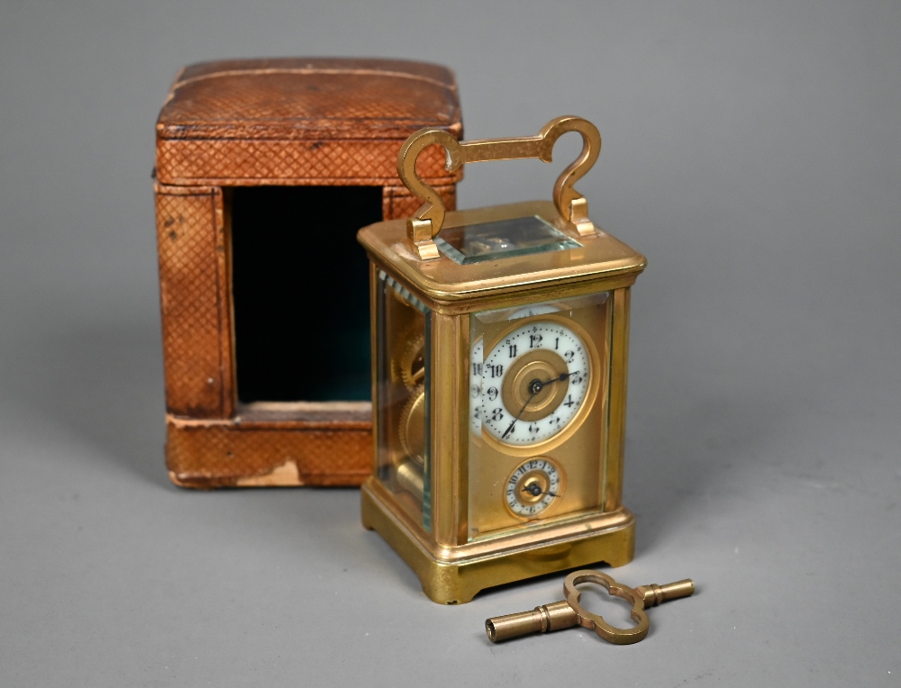 A miniature brass cased carriage alarm clock, 9 cm h