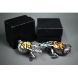 A pair of electroplated novelty salts, cast as frogs pulling snail shells surmounted by a beetle,