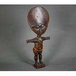 A vintage West African Acna'ba (fertility) doll with traditional broad head and outstretched arms,