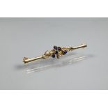 A 9ct yellow gold bar brooch set with sapphires and diamonds in leaf tendril setting, 5 cm long,