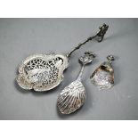 Antique French silver skimming spoon with decorative pierced bowl and scrolling stem, bears