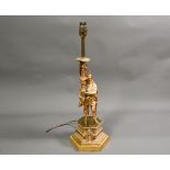 A 19th century Continental ormolu lamp-base, modelled as a Renaissance Florentine gentleman at arms,