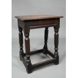 A 17th century oak joint stool, 43 cmx 27 cm x 53 cm h