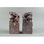 A pair of early 20th century Chinese carved and engraved soapstone bookends, red stone with buff