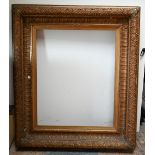 A large decorative 19th century picture frame with well-detailed mouldings depicting oak leaves