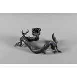 A Chinese bronze three-clawed Mizuchi Dragon, modelled with long scaly, sinuous body and fierce