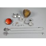 A quantity of white metal jewellery items including red Ruskin-type ceramic disc brooch, cz set